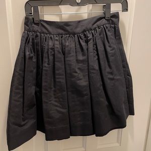 Black full skirt with yellow zipper